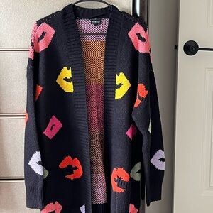 Torrid Black Cardigan with Vibrant Geometric Patterns